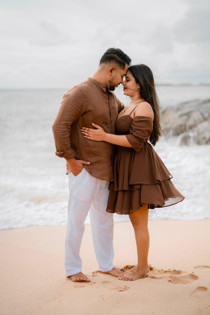 Poorni and Vimukthi embracing on the beach