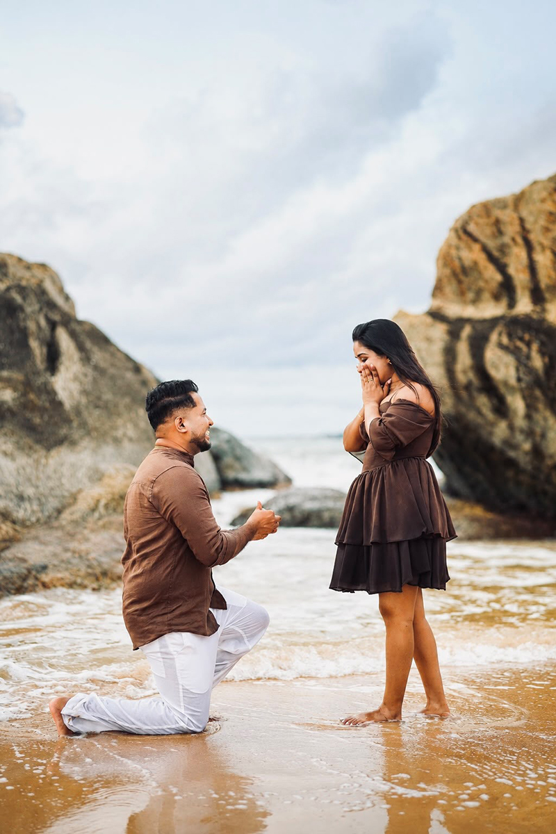 Proposal at sunset overlooking the ocean
